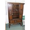 Image 1 : Antique single door oak china cabinet with decorative panels and bulbous feet, 63" high X 36" wide X