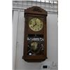 Image 1 : Oak cased vintage, chiming wall clock with brass base, labeled "Junghans", working at time of catalo