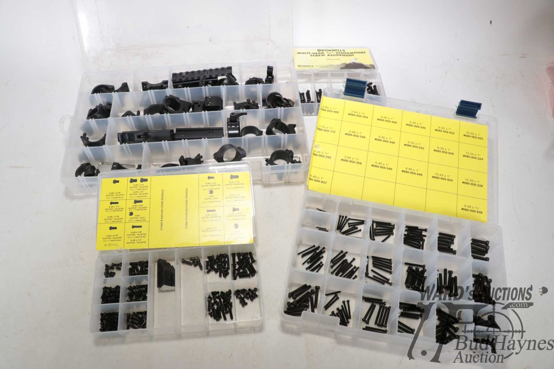 Four plastic containers of Brownells scope hardware including ...