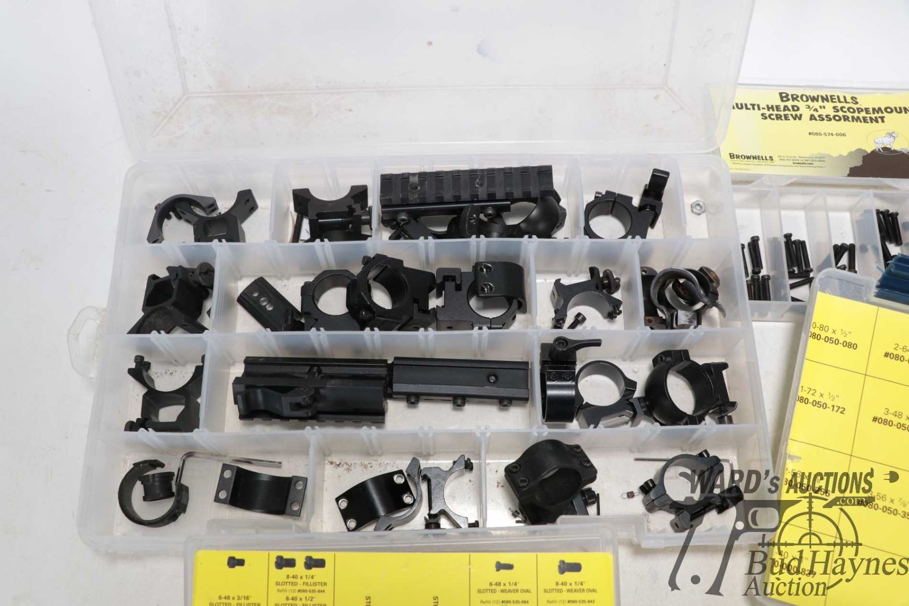 Four plastic containers of Brownells scope hardware including ...