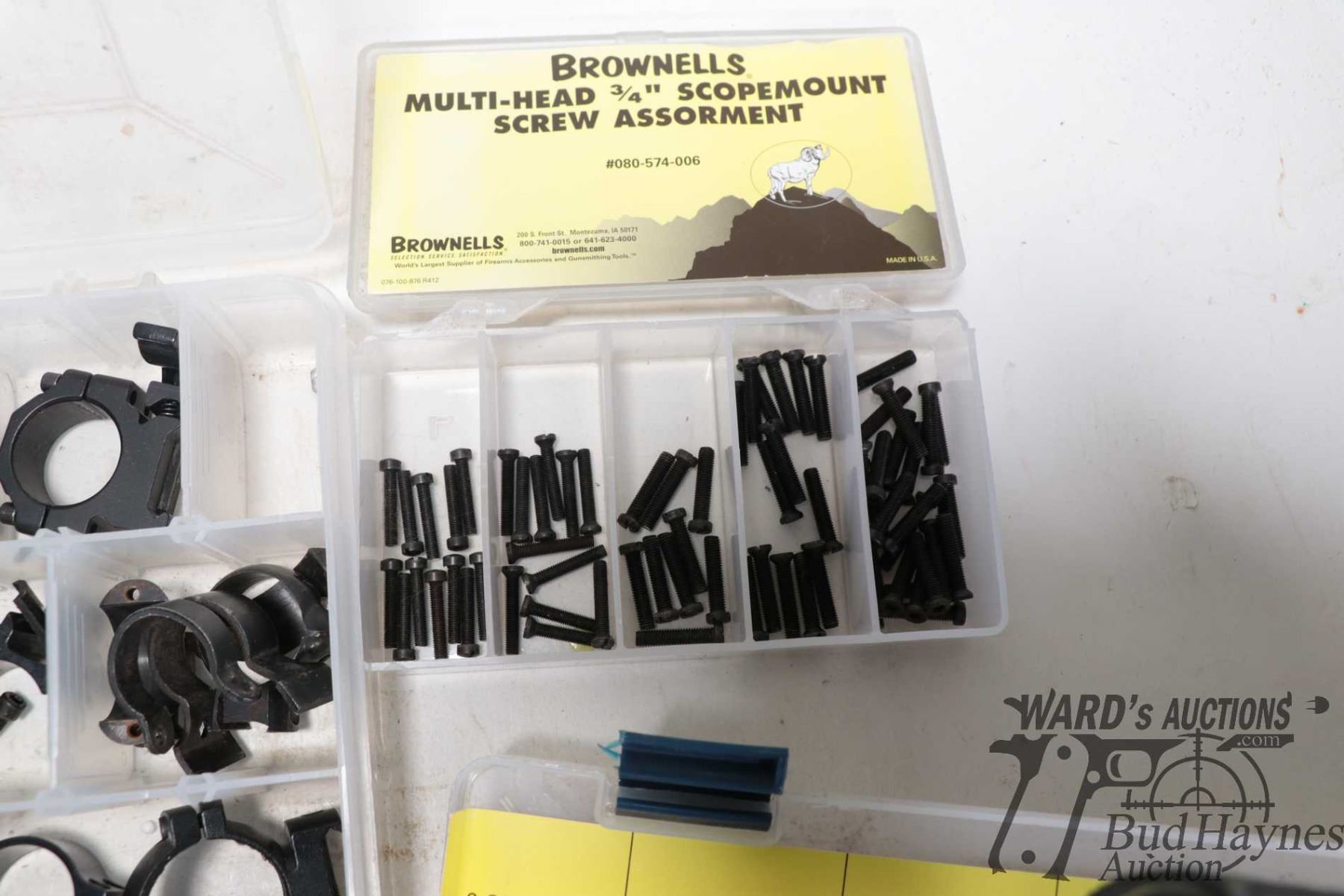 Four plastic containers of Brownells scope hardware including ...