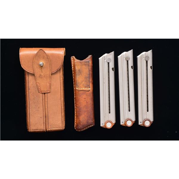3 FLAT BUTTON SWISS LUGER MAGAZINES & POUCHES.