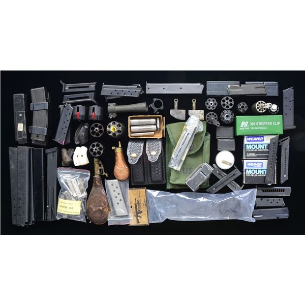 ASSORTED MAGAZINES & GUN PARTS.