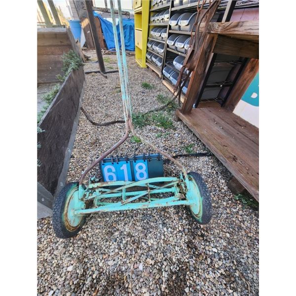 Vintage green push reel lawn mower