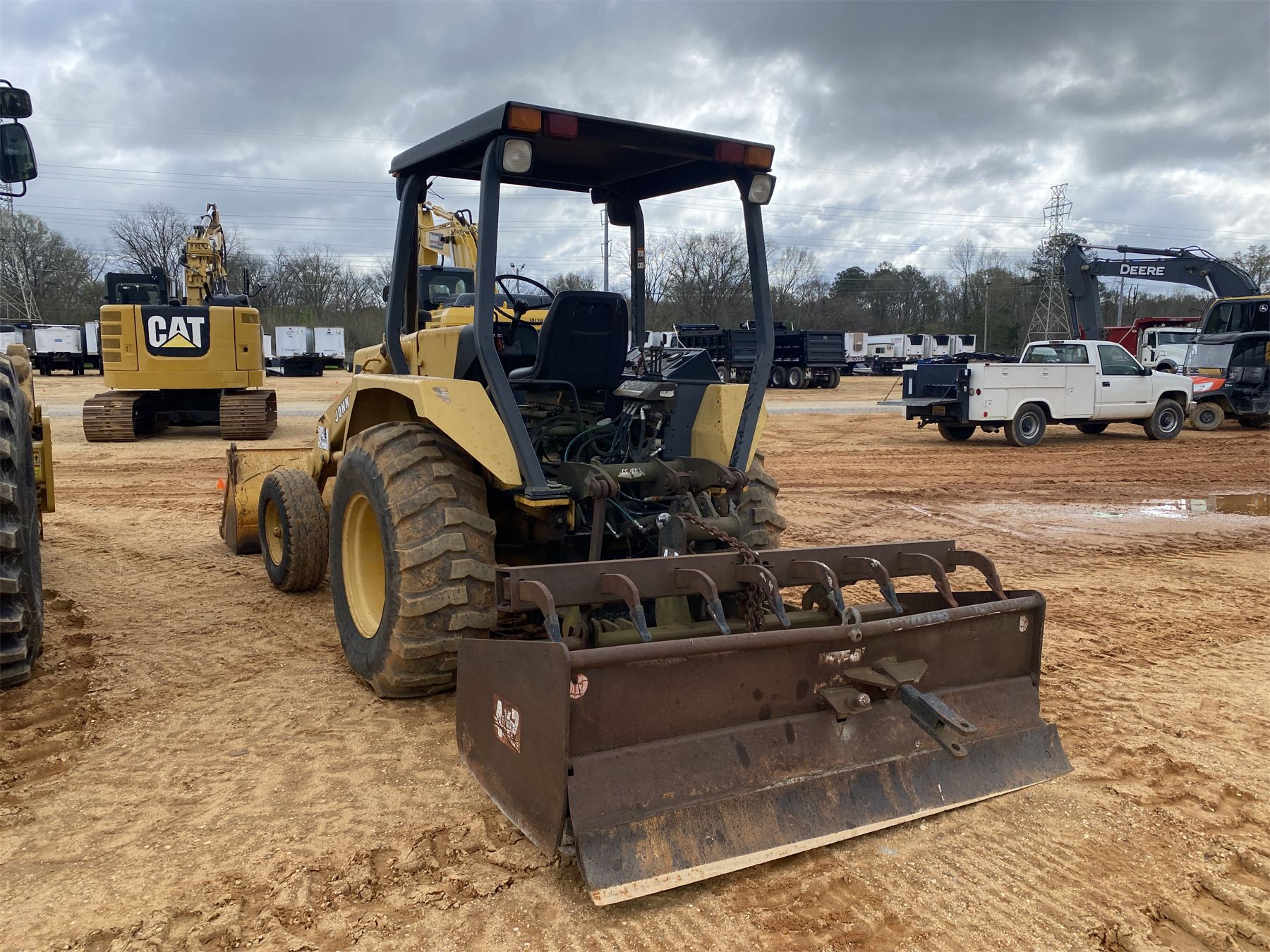 210c 1993 JOHN DEERE 210C Skip Loader - J.M. Wood Auction Company, Inc.