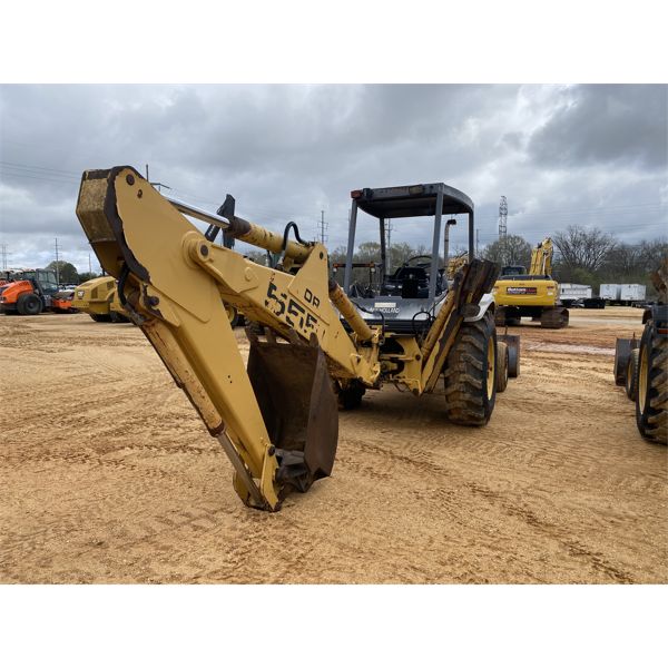 FORD / NEW HOLLAND 555E Backhoe - J.M. Wood Auction Company, Inc.