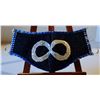 Image 1 : Mask with a Metis infinity symbol on a blue background (not used)