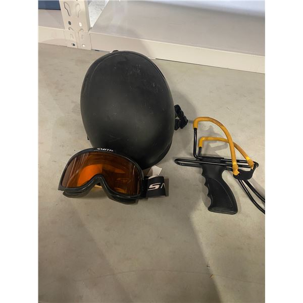 slingshot, helmet and goggles