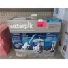 Image 1 : Waterpik Water Flosser Twin Pack - Open Box