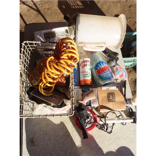 metal basket with misc oil jug toy revolver