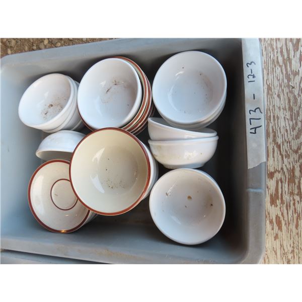 bus tub full of bowls and saucers