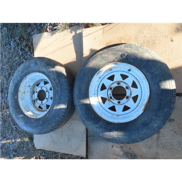 set of trailer tires and matching steel rims