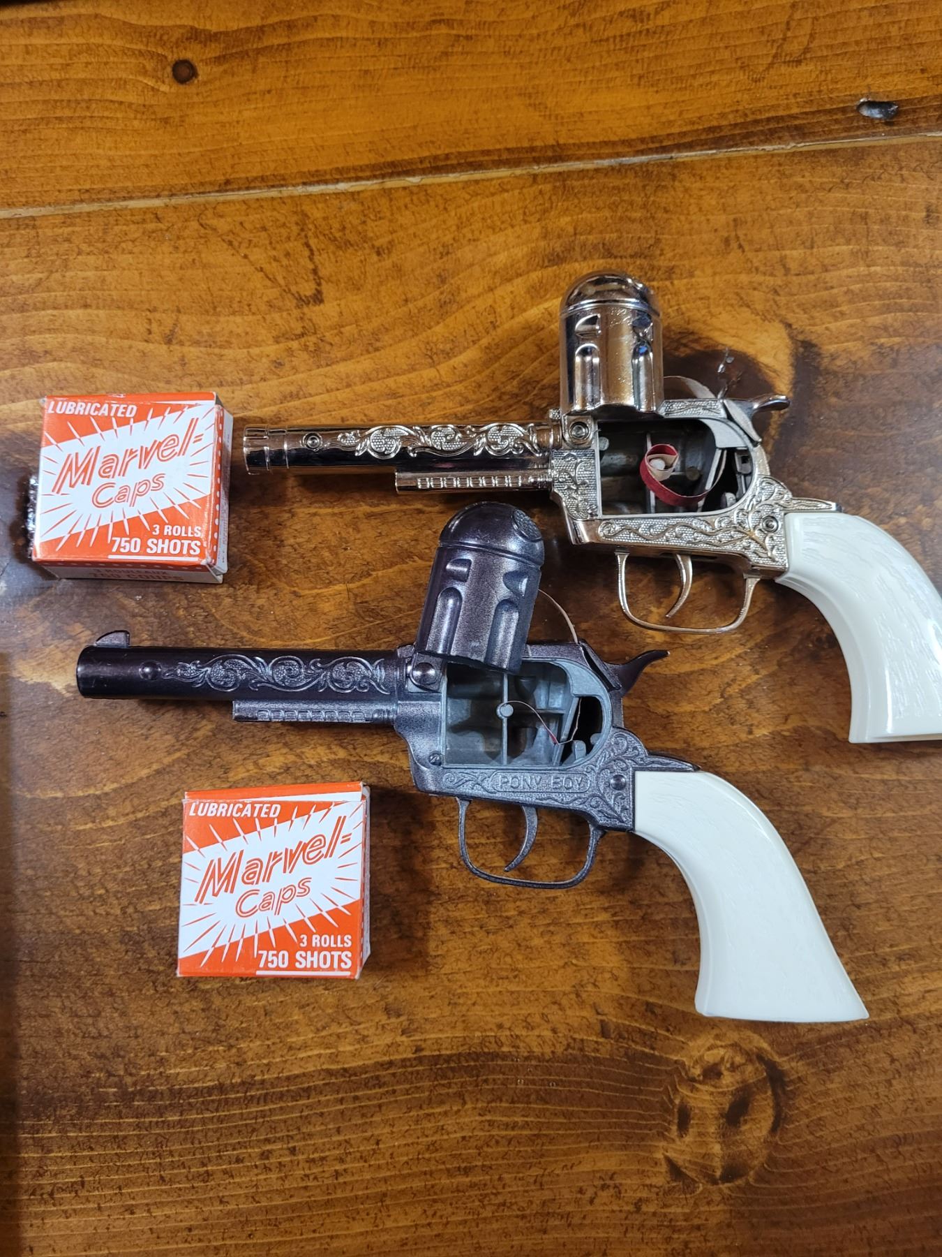 Cap Gun Fire Pair of vintage cap guns - one is pony boy both are excellent, loaded ...