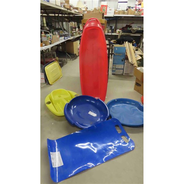 2 Plastic Sleds, 2 Plastic Saucers, 1 Slip n Slide