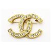 Image 1 : Chanel CC Brooch gold. rhinestones metal