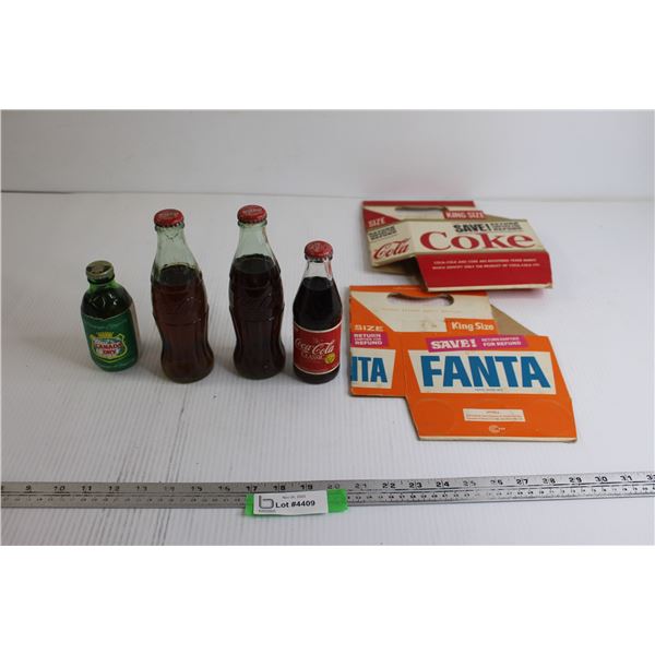 (4) Soda Bottles, (2) Paper 6-Packs