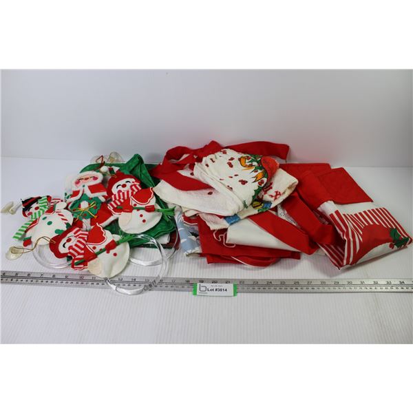 (7) Christmas Themed Aprons - Napkins - Rings w/Cloth Christmas Figures