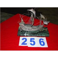 METAL BOAT ON GRANITE