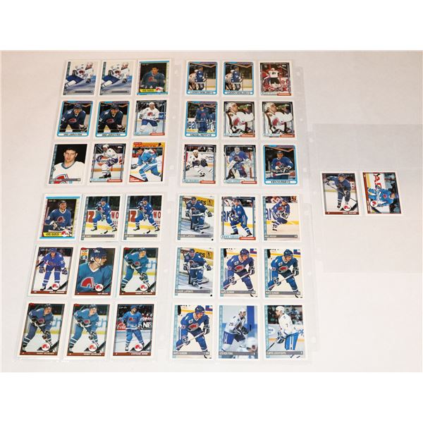 BUNDLE OF HOCKEY CARDS IN PROTECTIVE SLEEVES