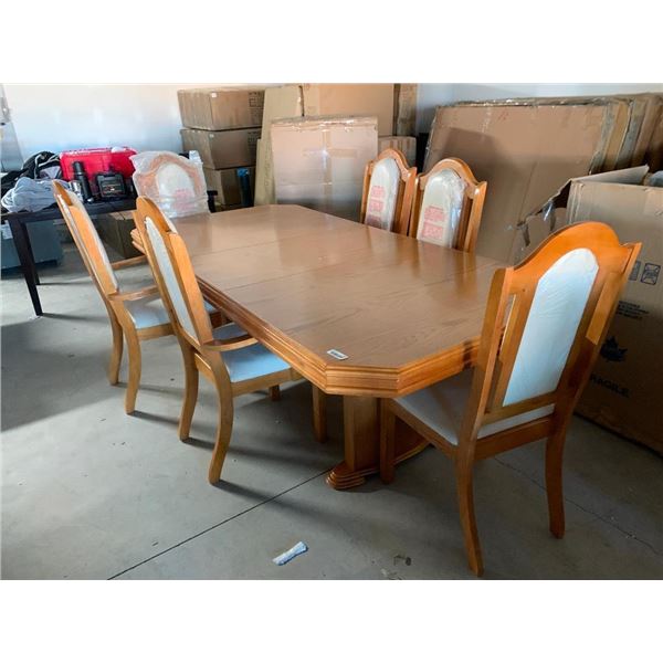 7 Piece Dinning Room Suite includes large rectange table with leaf and 6 matching upholstered chairs