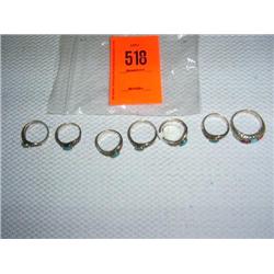 7 rings: 6 sterling silver ladies rings with turquoise and marcasite settings; 1 mans ring with turq