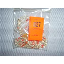 Multi-strand fresh water pearl necklace and earrings with coral accents. 20"