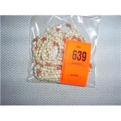 3 hand knotted fresh water pearl necklaces with coral and stearling accents. 32"