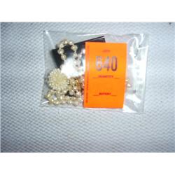 1 hand knotted fresh water pearl necklace and clip-on earrings. 28"