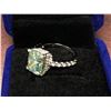 Image 1 : RADIANT CUT GREEN TONE MOISSANITE VVS WEIGHING APPROXIMATELY 5.60 CARAT IN CENTER WITH 40 CUBIC ZIRC