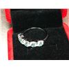 Image 1 : 5 FULL CUT ROUND BLUE TONE MOISSANITE VVS WEIGHING A TOTAL 2.60 CARAT TOTAL SET IN SILVER PLATED RIN