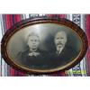 Image 1 : MAN AND WOMAN IN OVAL GLASS
