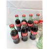 Image 2 : Coca-Cola Bottles (Some Full)