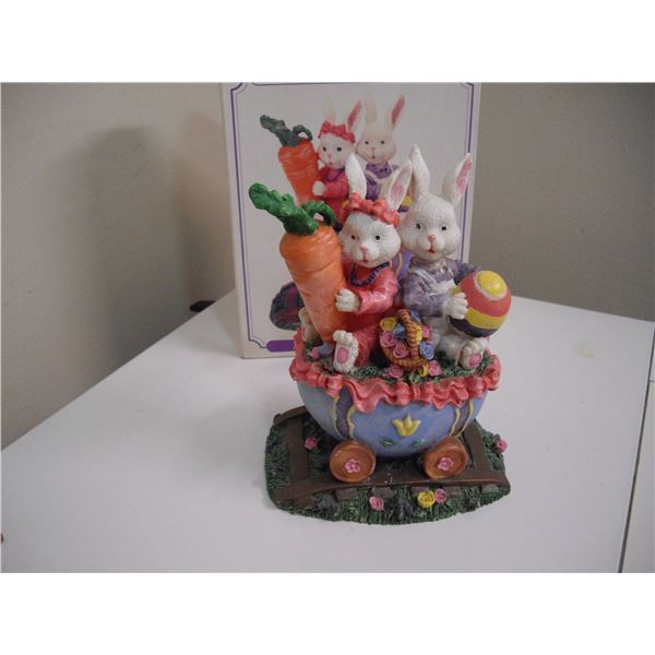 TWO RABBITS IN AN EGG CART