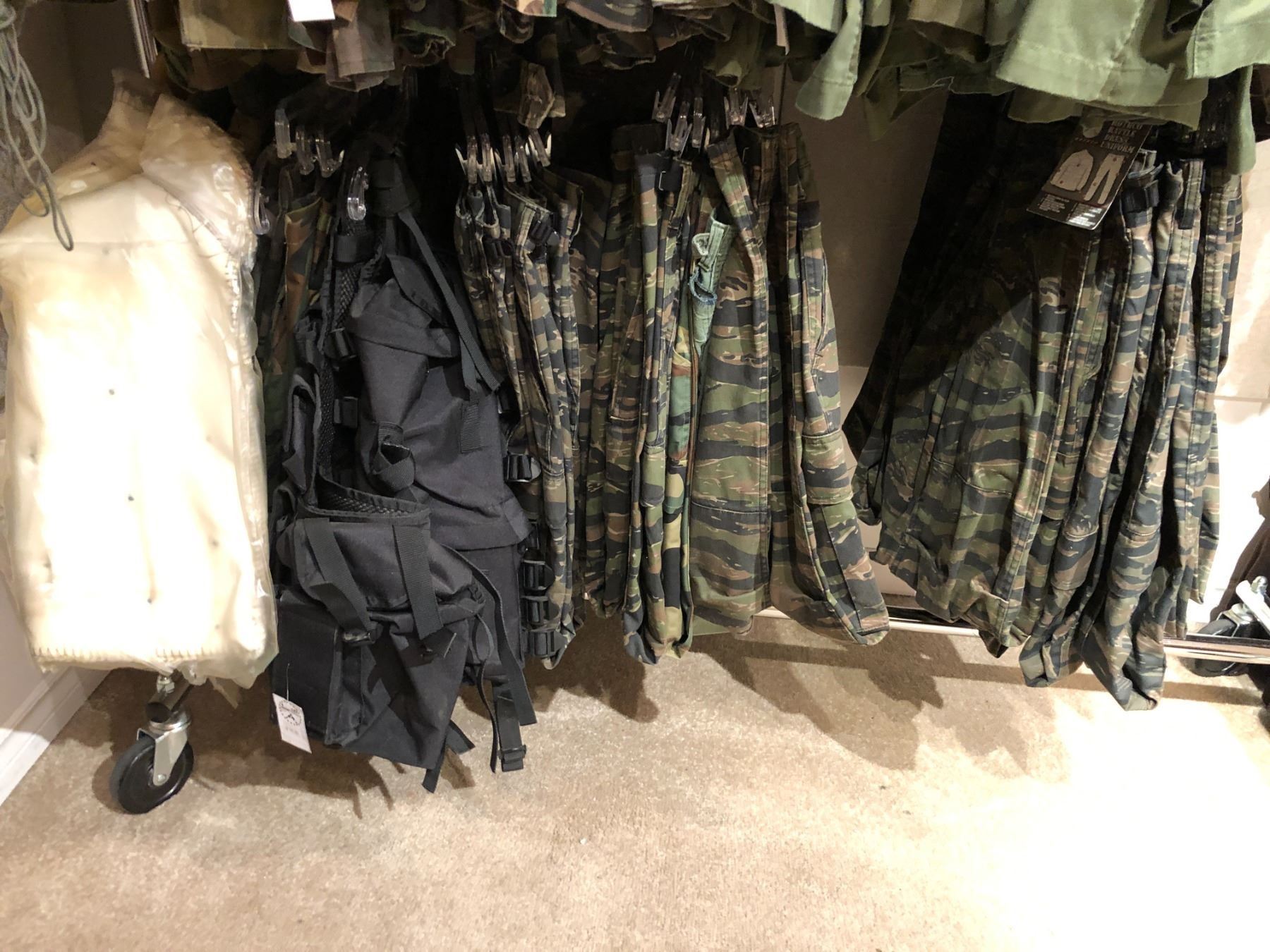 Large Group of Screen Worn Military Uniforms (Contents of 2 Racks)