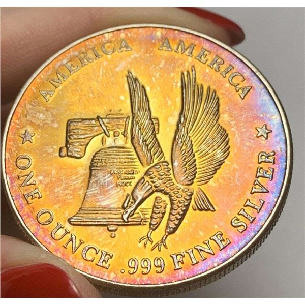 Toned America America The International Silver Trade Unit 1 ozt .999 Silver