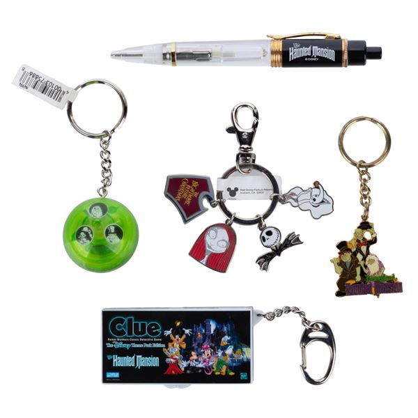 A Collection of Haunted Mansion Keychains and Pen.