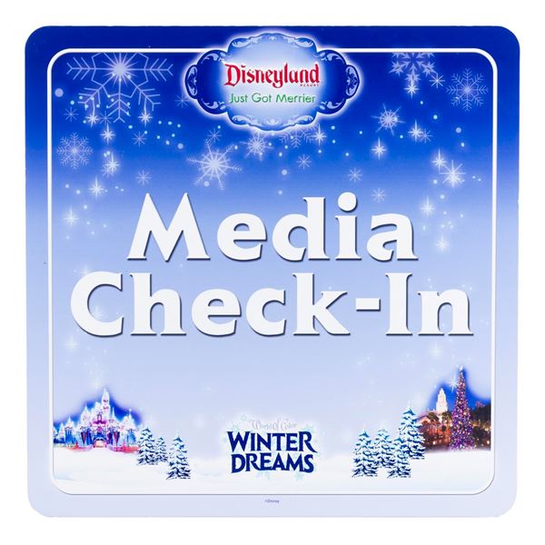 A "World of Color Winter Dreams" Media Check-In Sign.