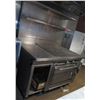 Image 1 : Montague Co. 18S Range w/ Fry-Top, Oven & Metal Shelf