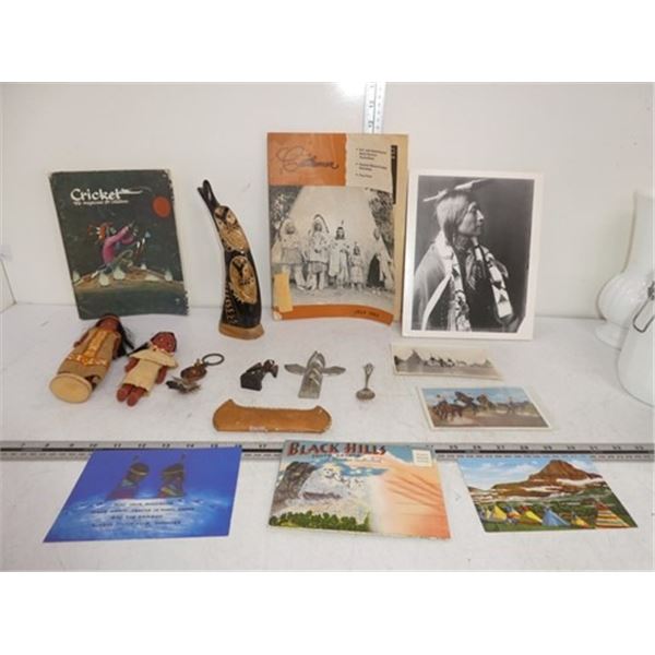 Collection of cultural books and ornaments,