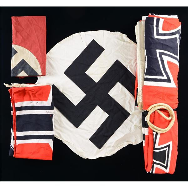 4 WWII GERMAN FLAGS & A CENTER DEVICE.