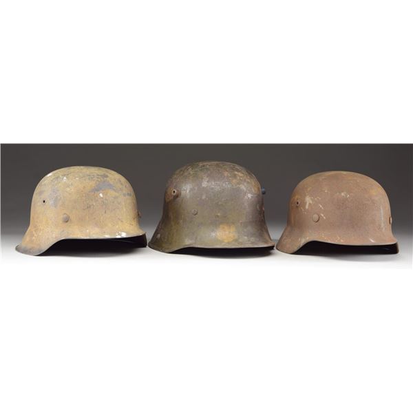 3 GERMAN HELMETS.