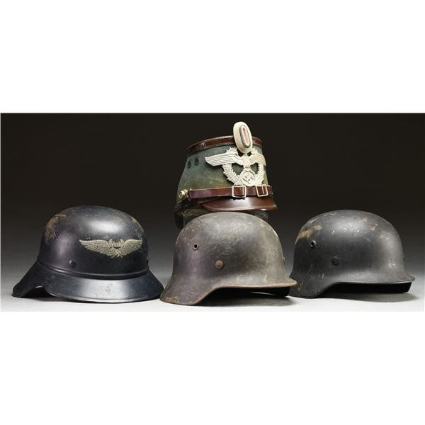 4 WWII GERMAN HELMETS.