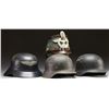 Image 1 : 4 WWII GERMAN HELMETS.