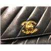 Image 2 : CHANEL BLACK LEATHER QUILTED PURSE WITH GOLD CHAIN STRAP AND FRINGE, MADE IN ITALY -