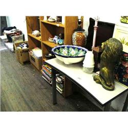 rolling table, hand made bathroom sink, collection of boxes, couple of lamps, 2 bookcases with assor