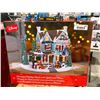 Image 1 : Disney Animated holiday house with lights and music.