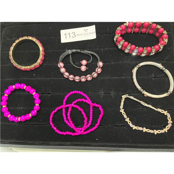 Assortment Of Pink Themed Braclets And Breast Cancer Awareness Bracelets