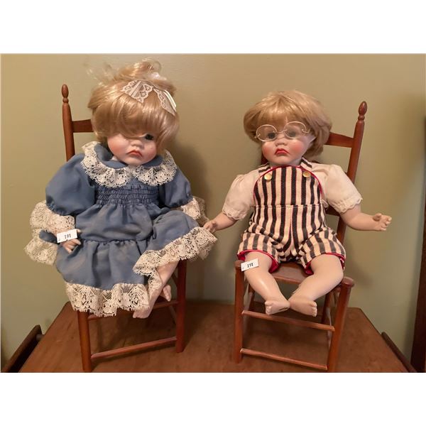 Two Dolls In Chairs