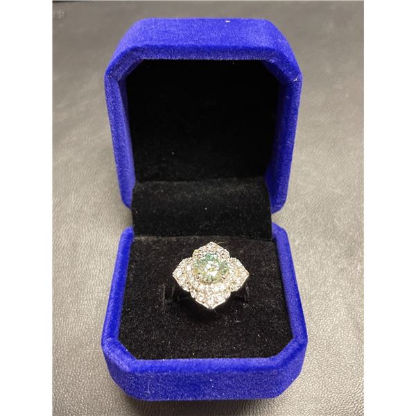 One Bluish green moissanite VVS in center weighing approx. 2.15 carat w/40 cubic zirconium approxima