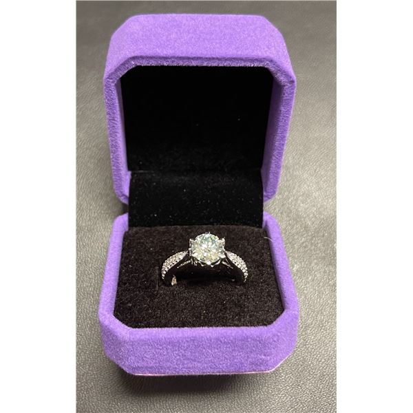 One full cut round brilliant moissanite VVS weighing approx. 2.15 carat set in center of ring silver